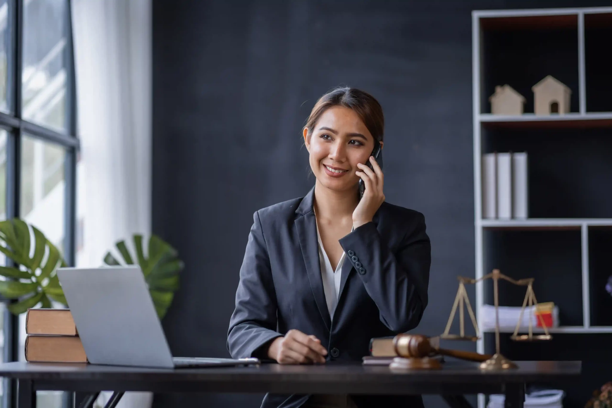 Lawyer using Indosoft’s intelligent legal solution to discuss case details and deliver faster, secure client support. Lawyer consulting with a client in a modern office using Indosoft’s AI-powered legal solution to securely access client data and case updates.