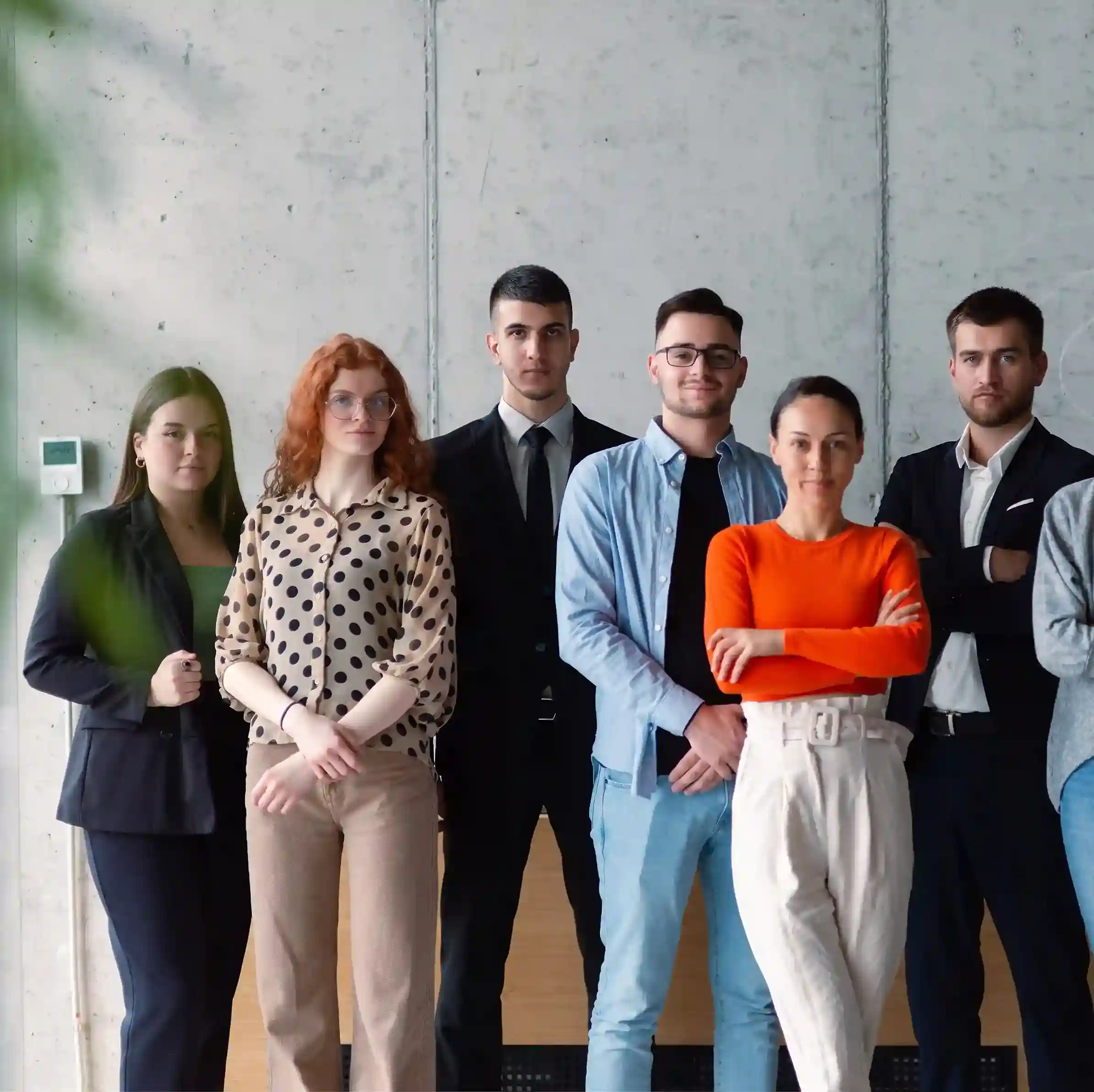 Employees of Indosoft posing together, reflecting the company’s mission to blend human connection with automation. Group of Indosoft employees standing together, representing teamwork and innovation in AI-powered contact center technology.