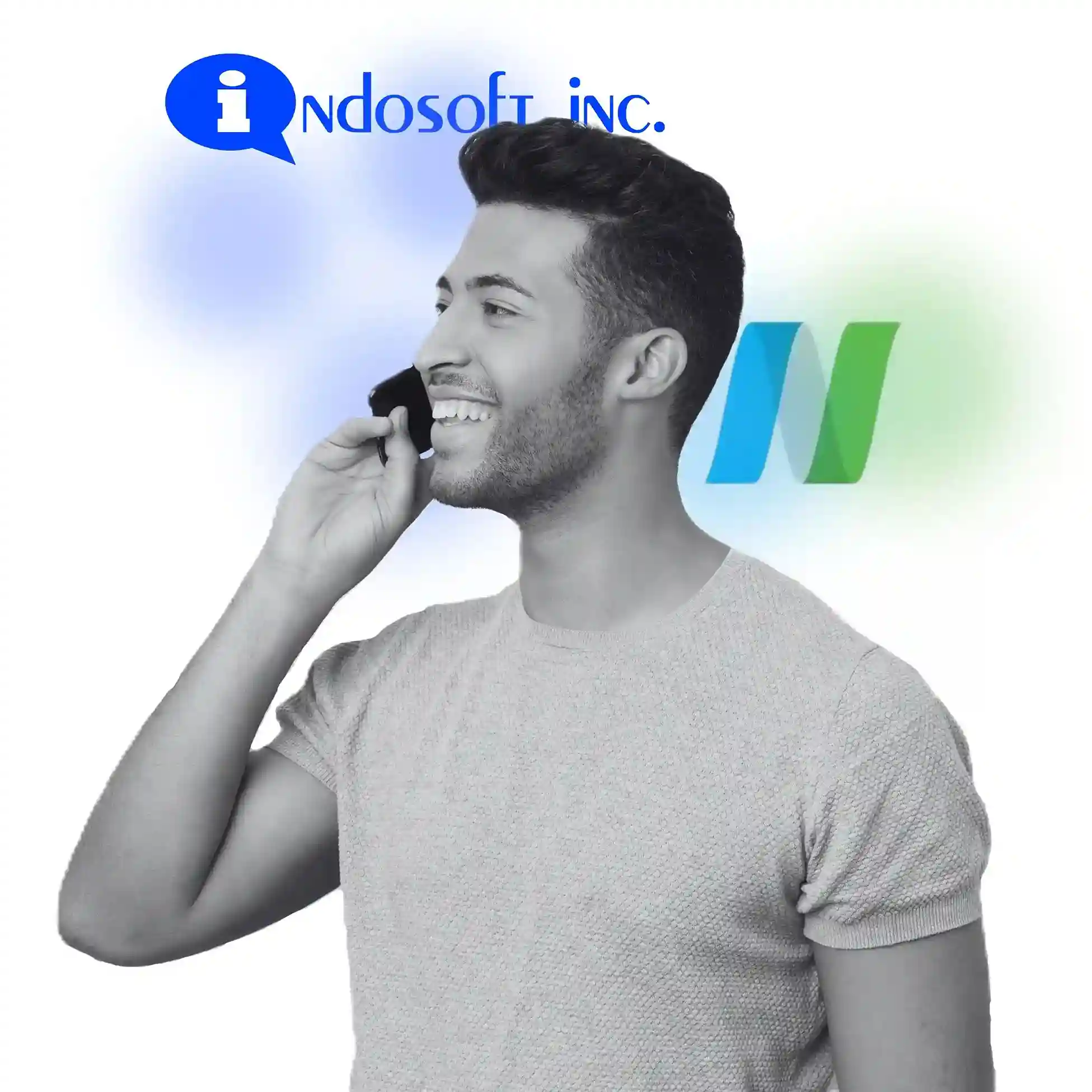 The image shows a cheerful caller, reflecting the effortless communication experience Indosoft delivers. Compared to NUACOM, Indosoft provides deeper adaptability and stronger control for evolving business needs. Man talking on the phone with Indosoft and NUACOM branding behind him, symbolizing adaptable communication control.