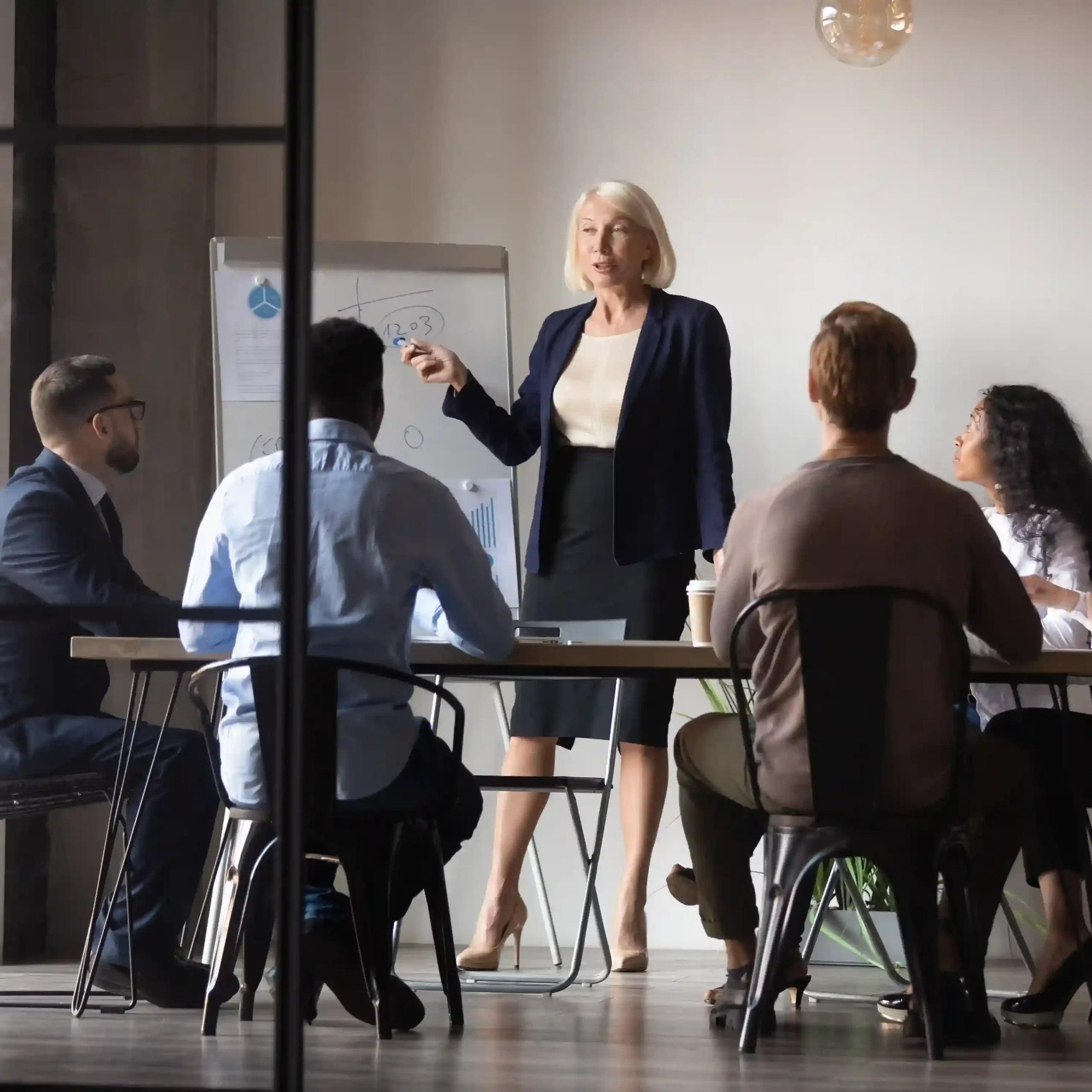 Indosoft’s leadership team meets to evaluate opportunities, refine product direction, and ensure every milestone supports innovation, scalability, and customer value. Indosoft leadership team collaborating in a conference room to plan AI-driven solutions