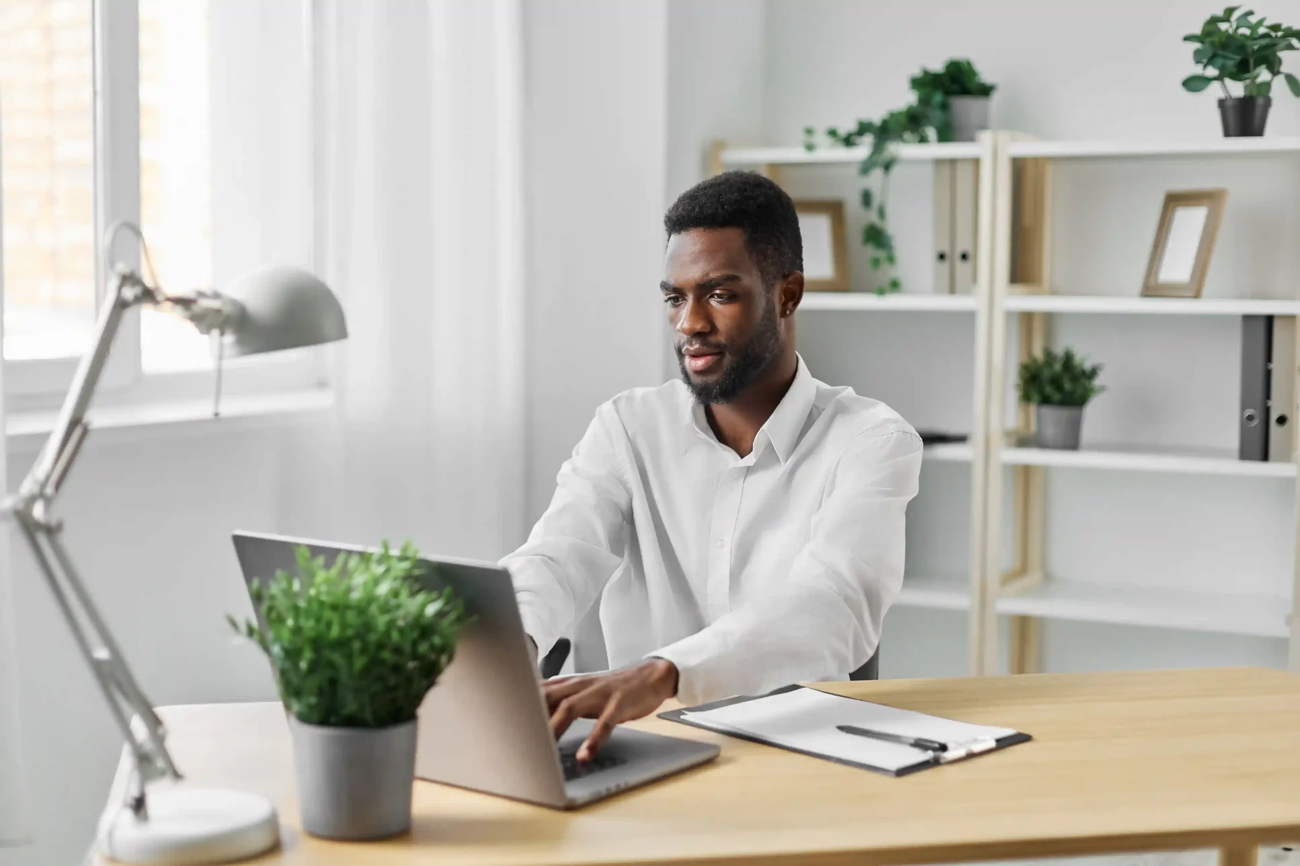 A professional reviews his work dashboard knowing each outbound call is being logged automatically for follow-ups and reporting. An agent focuses on his laptop as call details are captured automatically in the background, showing how activity logging keeps records accurate without extra effort.