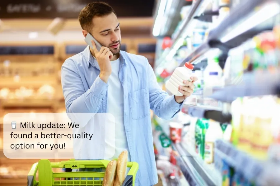 Shopper receiving a targeted message from Indosoft with a recommended milk option for improved clarity. Customer in a grocery store receiving a visual MMS update from Indosoft about better milk options.