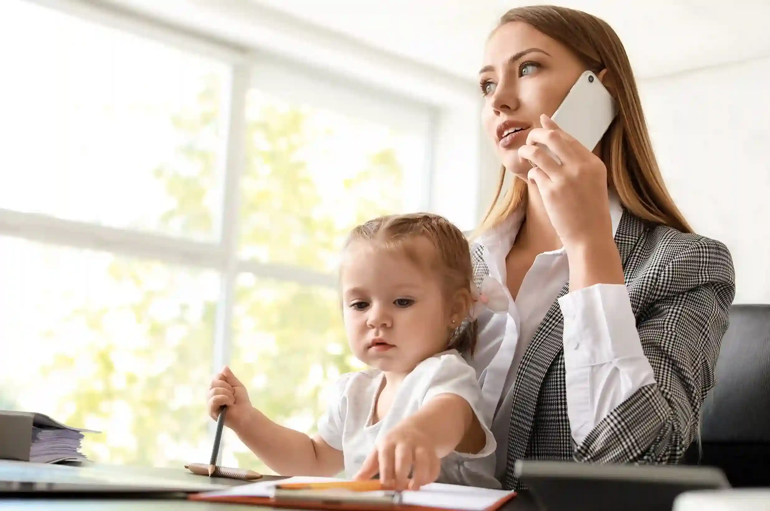 While managing work and family, an agent uses Indosoft to place a call on hold and collaborate with supervisors before returning to the caller. A working mother places a caller on hold using the Indosoft solution while consulting her team, ensuring the caller experience remains professional and uninterrupted.