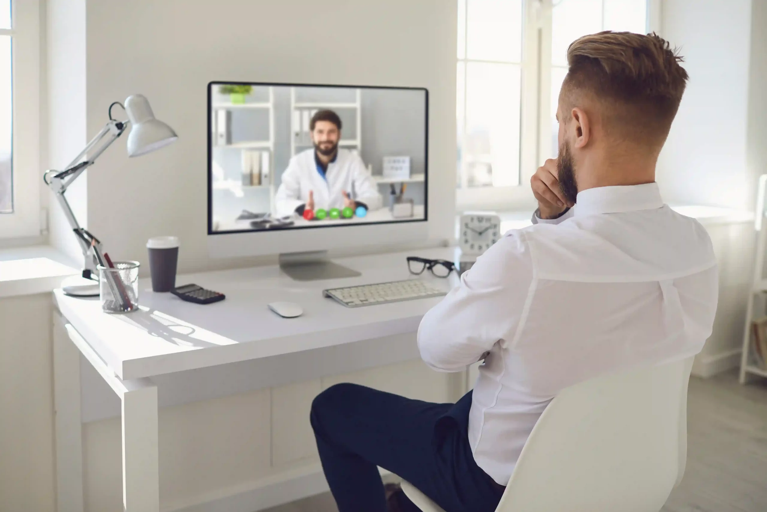 A patient connects with a healthcare professional from home, relying on Indosoft call masking to meet industry privacy expectations. A patient speaks with a doctor through a secure video call, using Indosoft call masking to protect personal contact details during regulated communication.