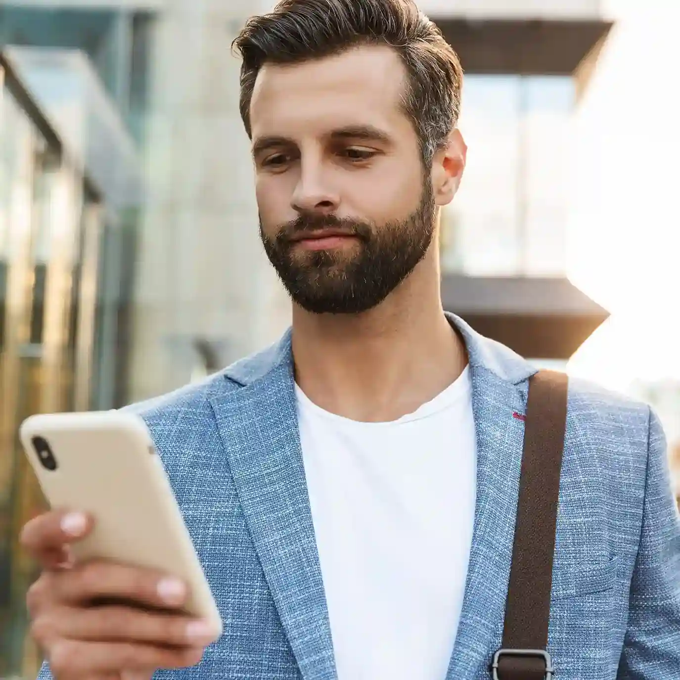 A business professional reviews contact history on his mobile device, preparing for a more relevant and productive customer conversation. A professional checks customer details on his phone before starting a conversation, using organized contact information to respond with confidence and clarity.