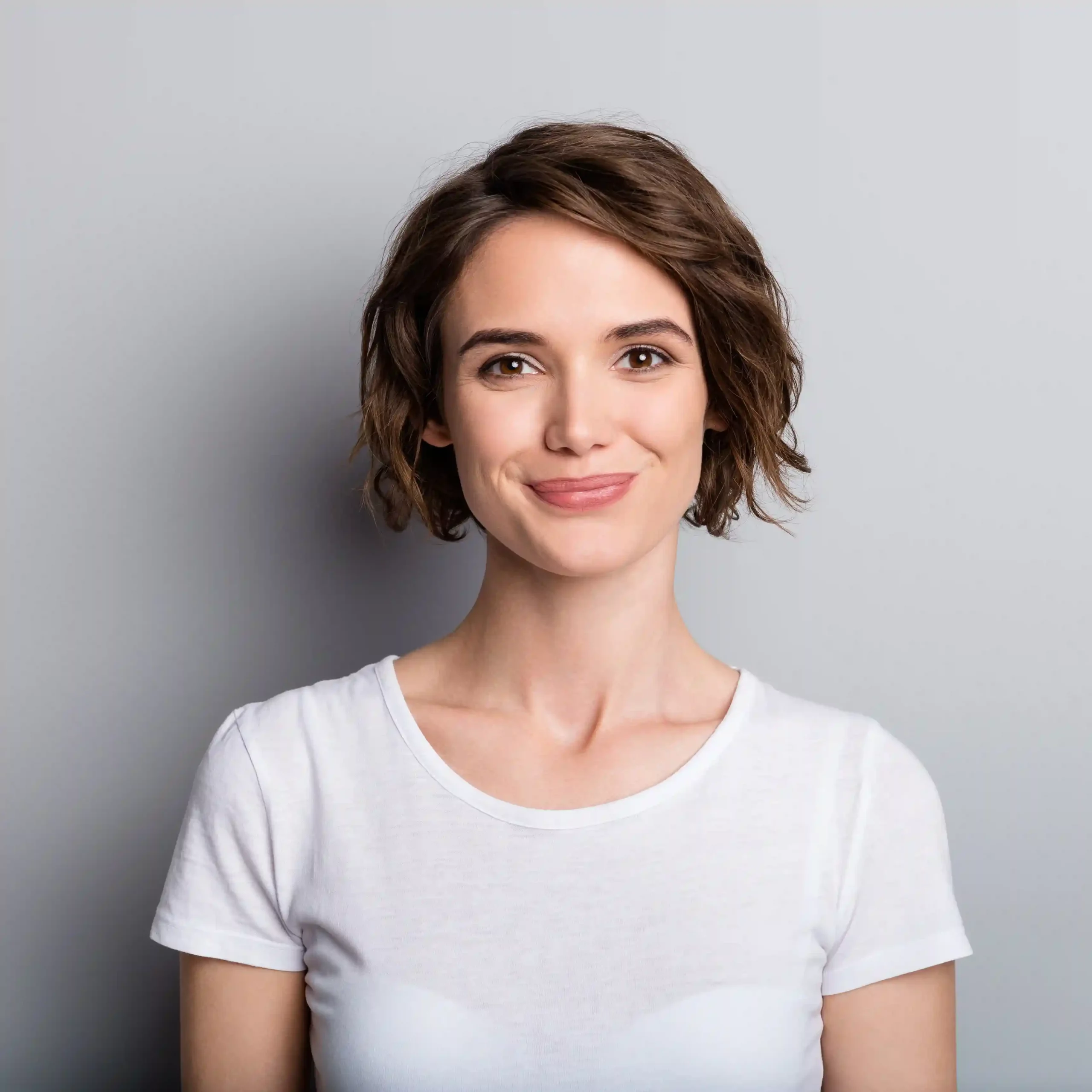 A professional smiling confidently, symbolizing expert support for enterprise Bulk SMS communication. A confident professional representing expert guidance for scaling communication with Bulk SMS solutions.