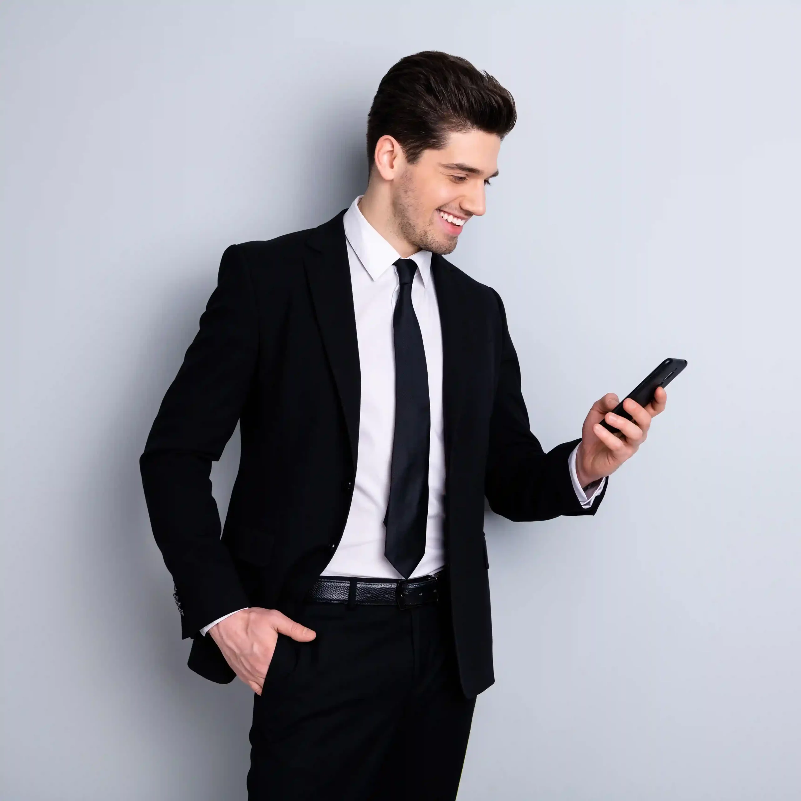 A professional checks a message on his phone with confidence, reflecting how messaging enables faster responses and smoother customer interactions. A business professional reviews a customer message on his phone, seeing how messaging fits seamlessly into daily contact center communication.