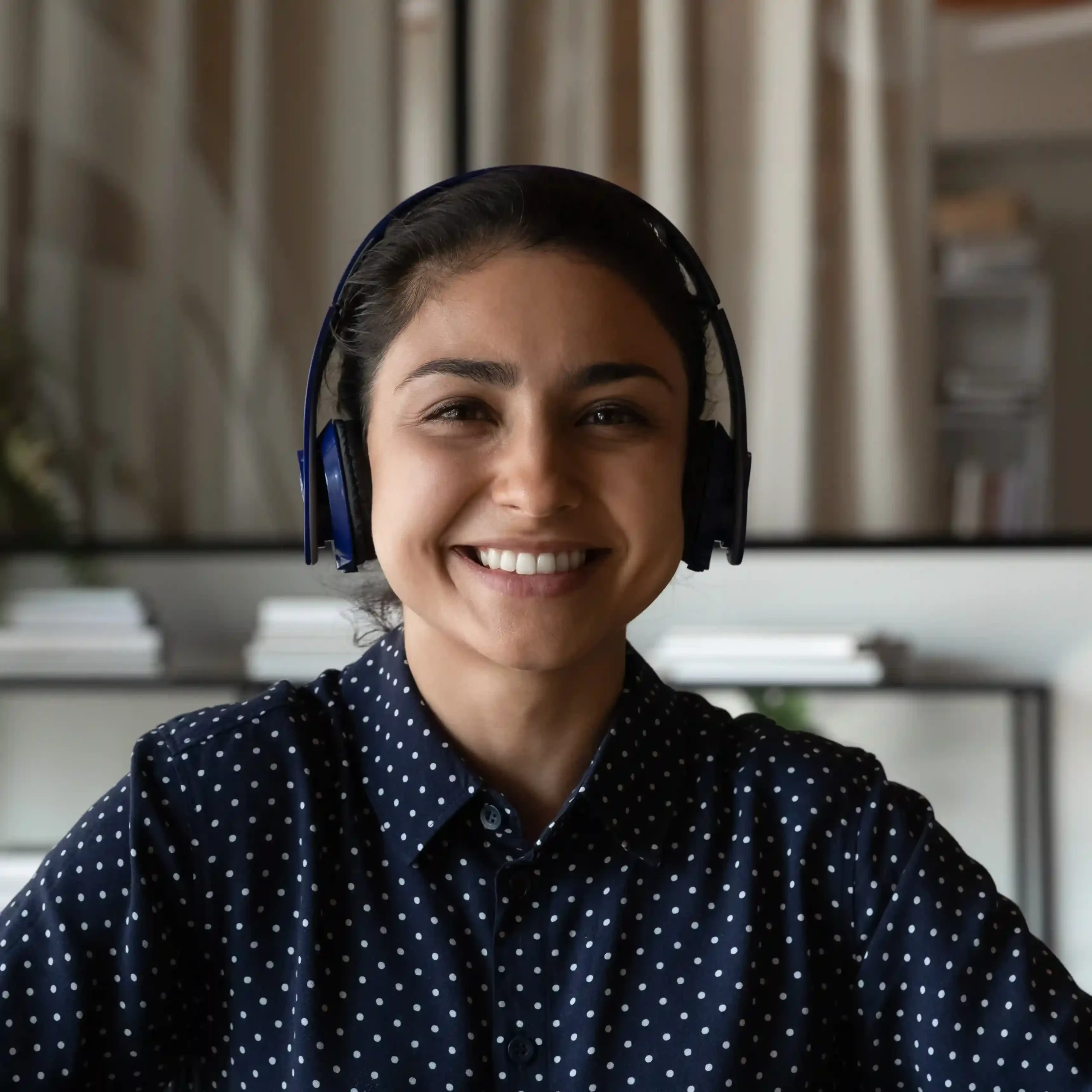 An agent engages customers with confidence, using Indosoft’s modern contact center tools while continuing to receive calls on the same trusted business numbers. A contact center agent smiles while wearing a headset, confidently assisting customers as her organization upgrades to Indosoft without changing familiar business phone numbers.