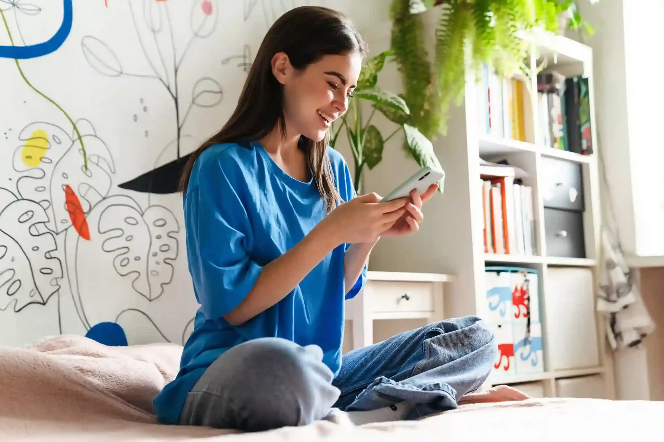 A user comfortably seated and monitoring large-scale SMS delivery on her mobile phone with confidence. A customer smiling while reviewing successful bulk text message delivery on her smartphone using a high-volume messaging platform.