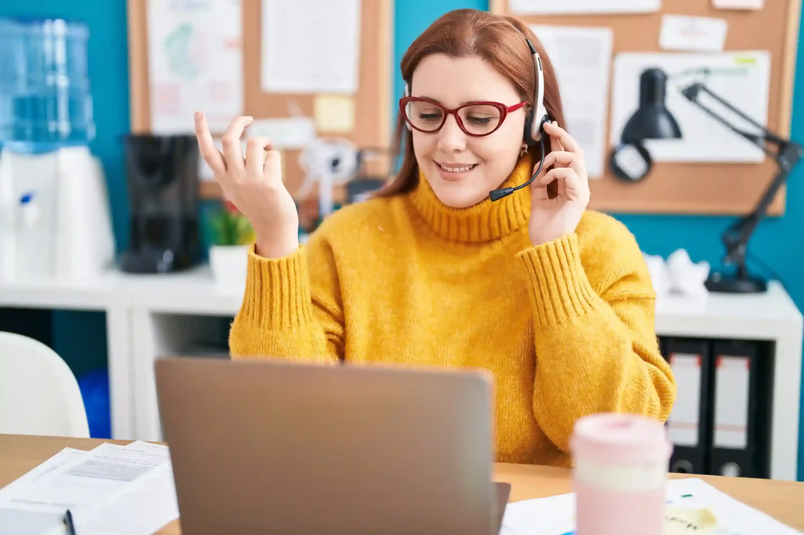 A team member reviews voicemail settings on her screen, adjusting sorting rules in Indosoft to ensure messages are routed and grouped correctly. An employee confidently works on her laptop while setting up voicemail sorting rules, using Indosoft to automatically organize incoming messages based on business needs.