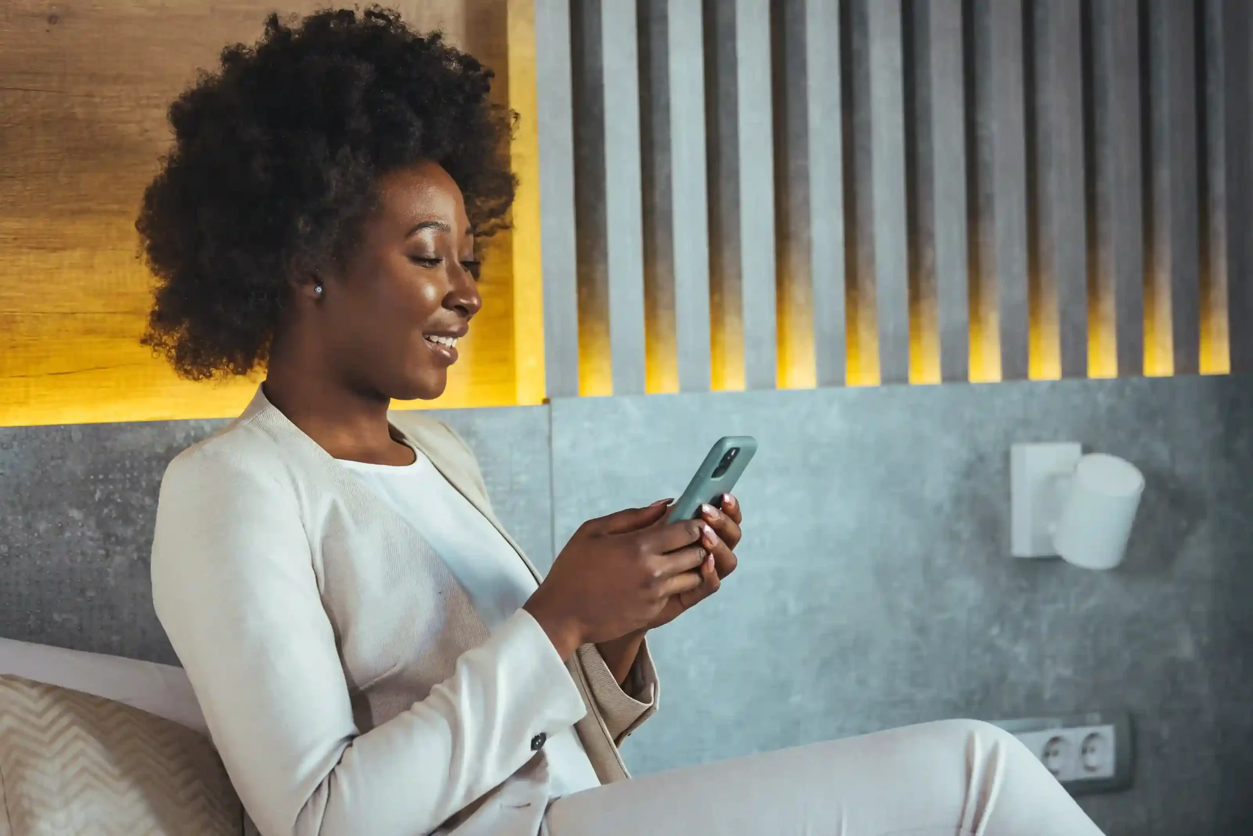 A team member reviews messages on her mobile device, relying on Indosoft to manage calls through a shared group number with clear responsibility across the team. A professional checks a call update on her phone in a calm workspace, confidently handling customer communication through a shared team number managed with Indosoft.