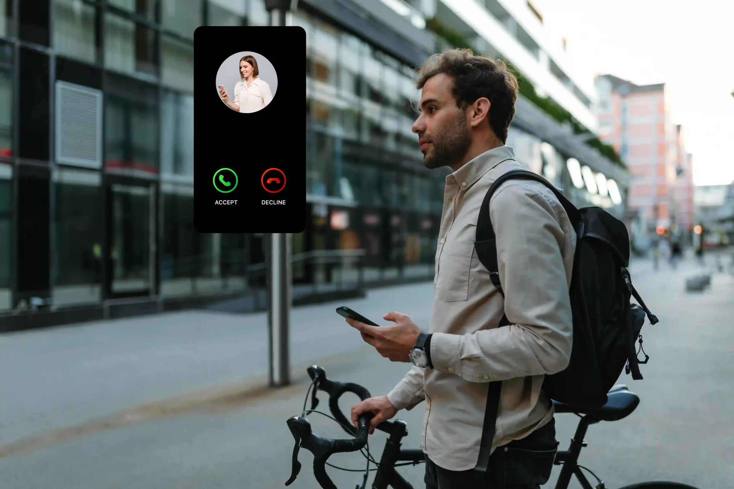 A field-based employee checks their phone while preparing to make a call, reflecting how agents can select a trusted outbound number to improve answer rates and credibility. A mobile professional pauses with a bicycle while reviewing an incoming call, representing an agent choosing the most appropriate business number before placing an outbound call.