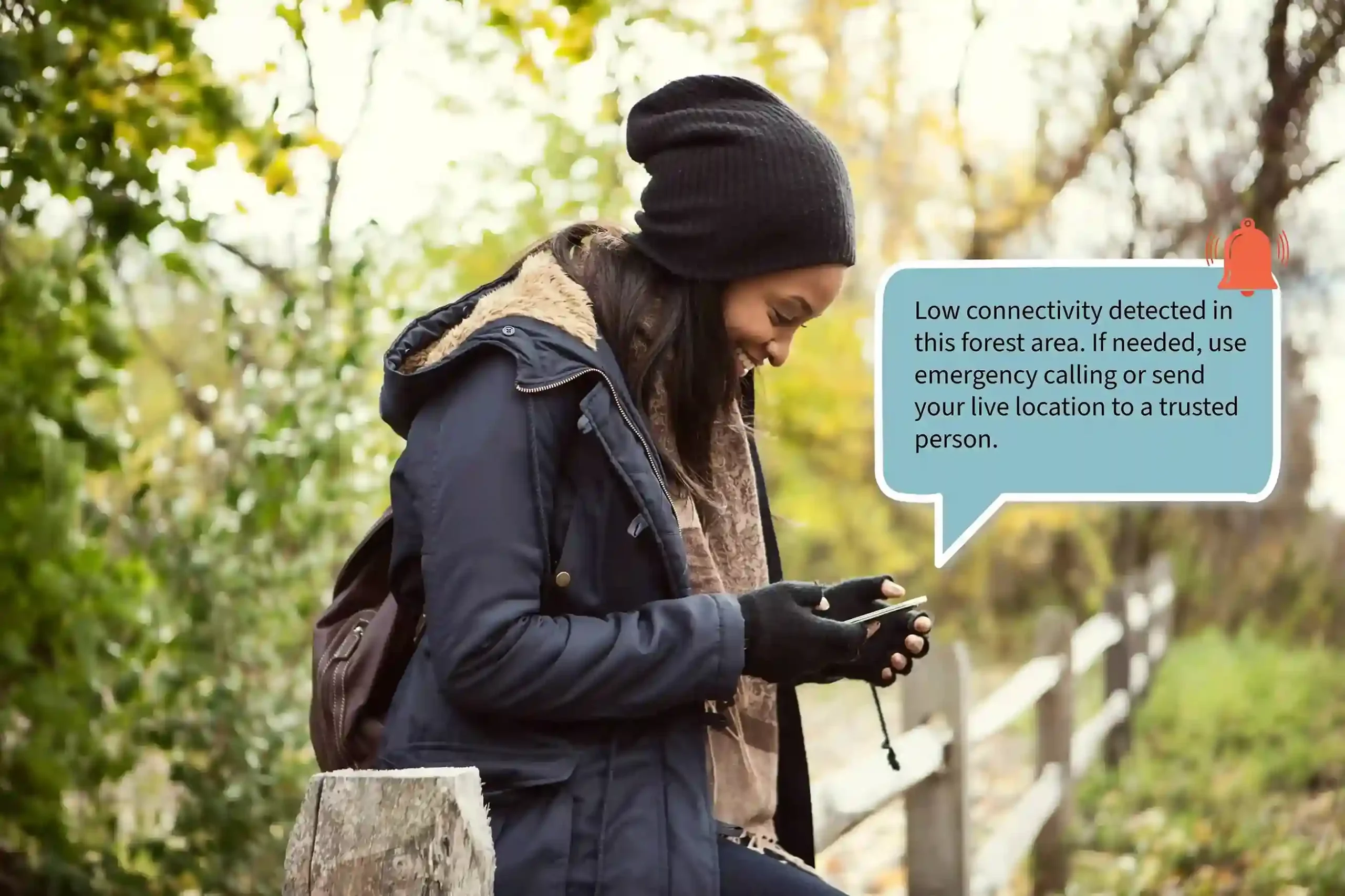 A woman pauses on a forest trail to review a call alert on her phone, showing how notifications surface urgent information at the right moment. A solo traveler checks her phone while walking through a forest as a call notification alerts her to important activity despite limited connectivity.