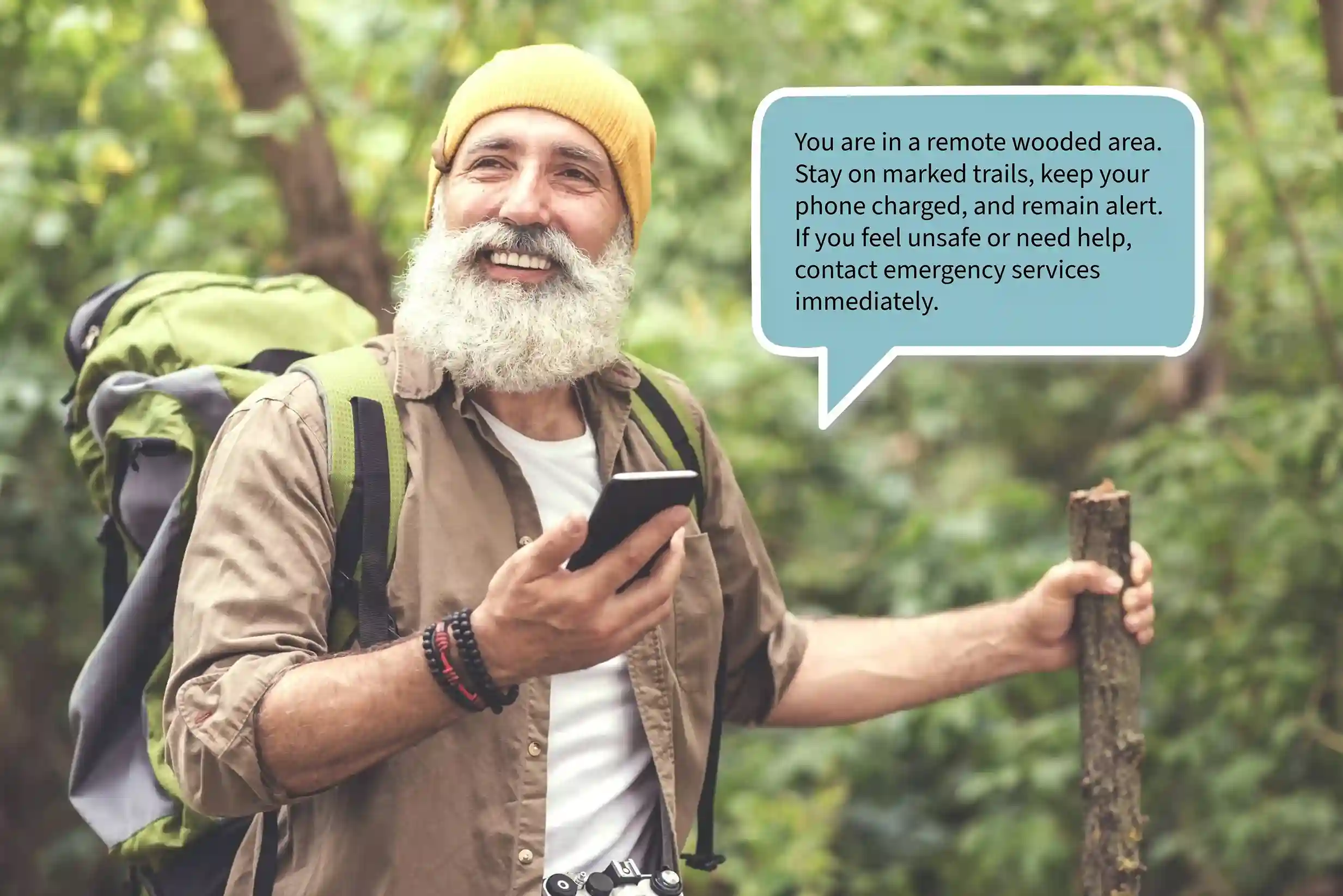An individual pauses during a journey to read a safety message on his phone, demonstrating how messaging enables organizations to communicate essential guidance clearly and without delay. A traveler checks an important message on his phone while in a remote area, showing how timely messaging helps organizations deliver critical updates without requiring a call.