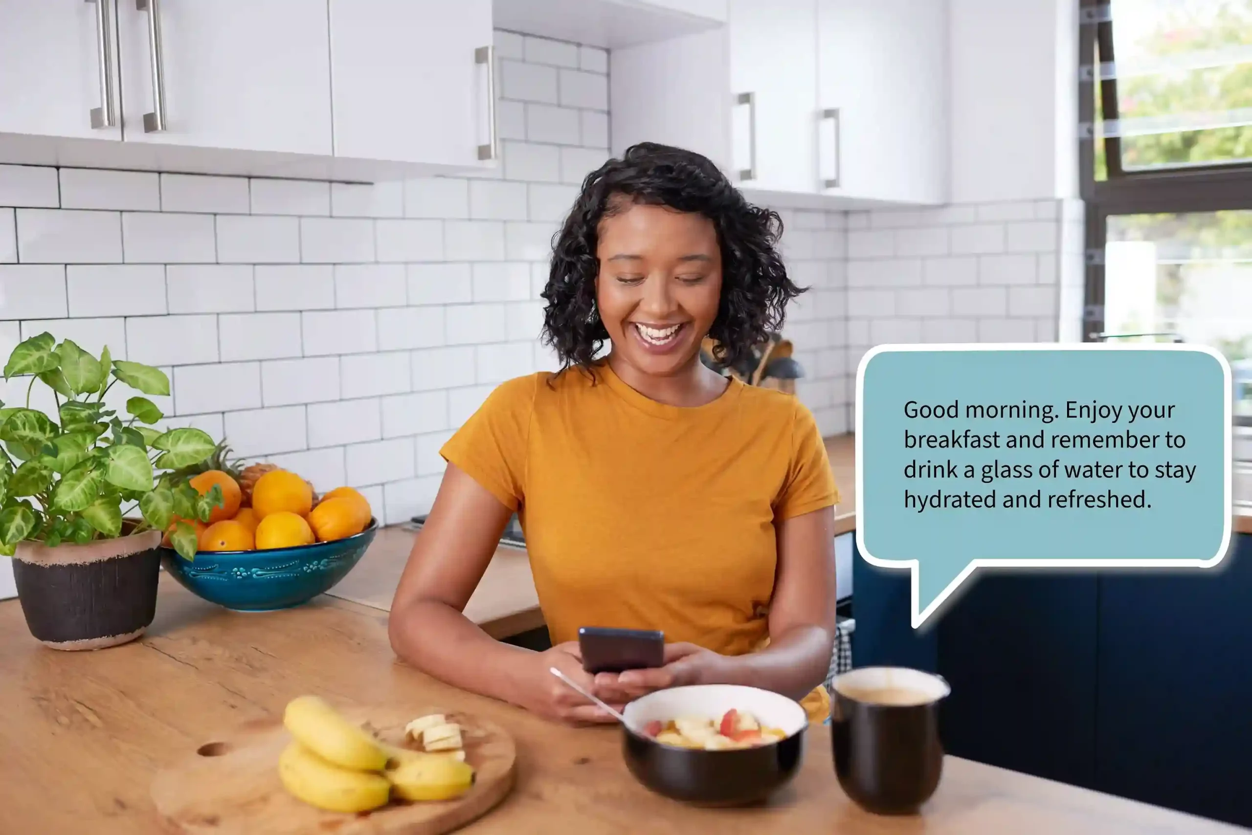 A customer smiles while reading a pre-scheduled health reminder on her phone during a calm breakfast routine at home. A woman enjoys breakfast at her kitchen table while checking a scheduled wellness message that arrived at the perfect morning moment.