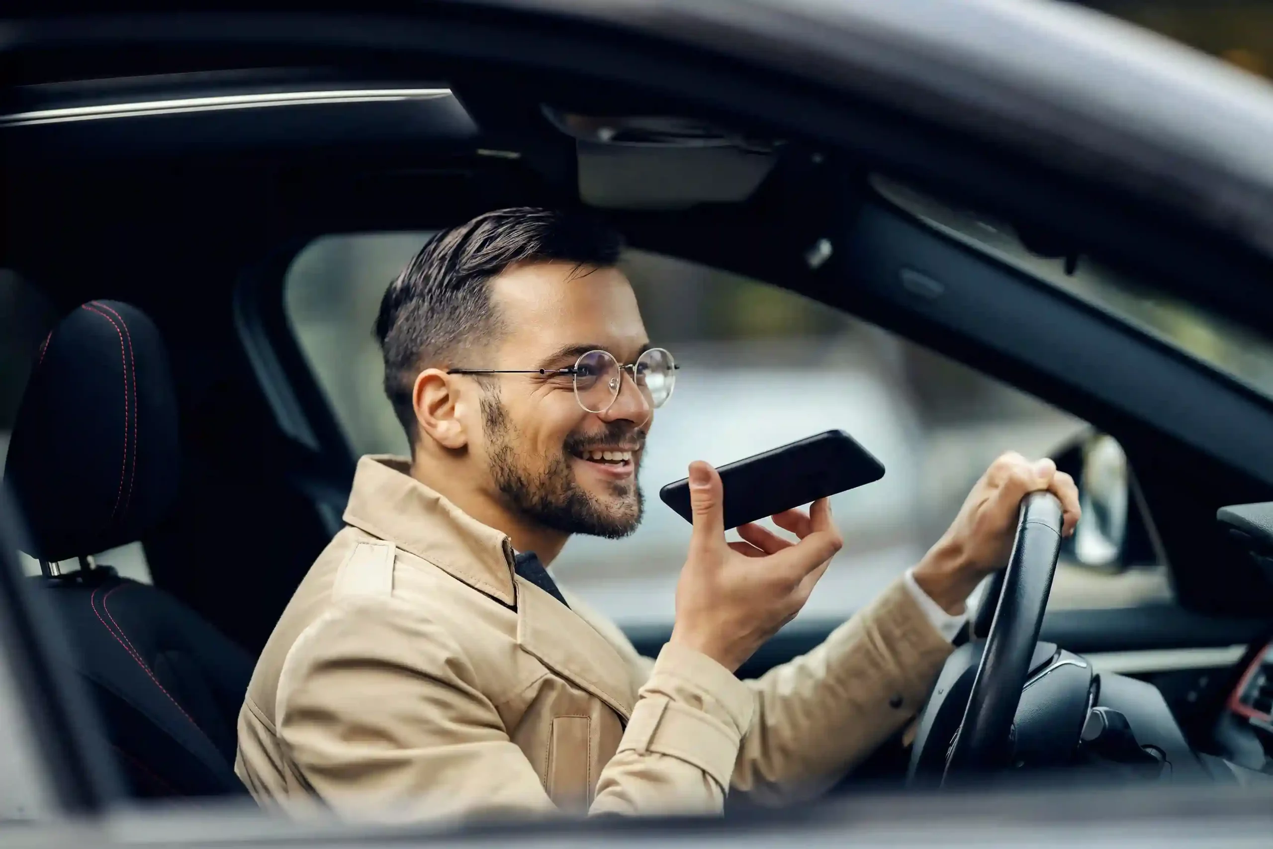 A customer reviews a voicemail message on his phone during a busy commute, showing how voicemail filter organizes messages so critical information is never missed. A professional listens to a voicemail hands-free while driving, illustrating how voicemail filter helps important messages surface quickly without manual sorting.