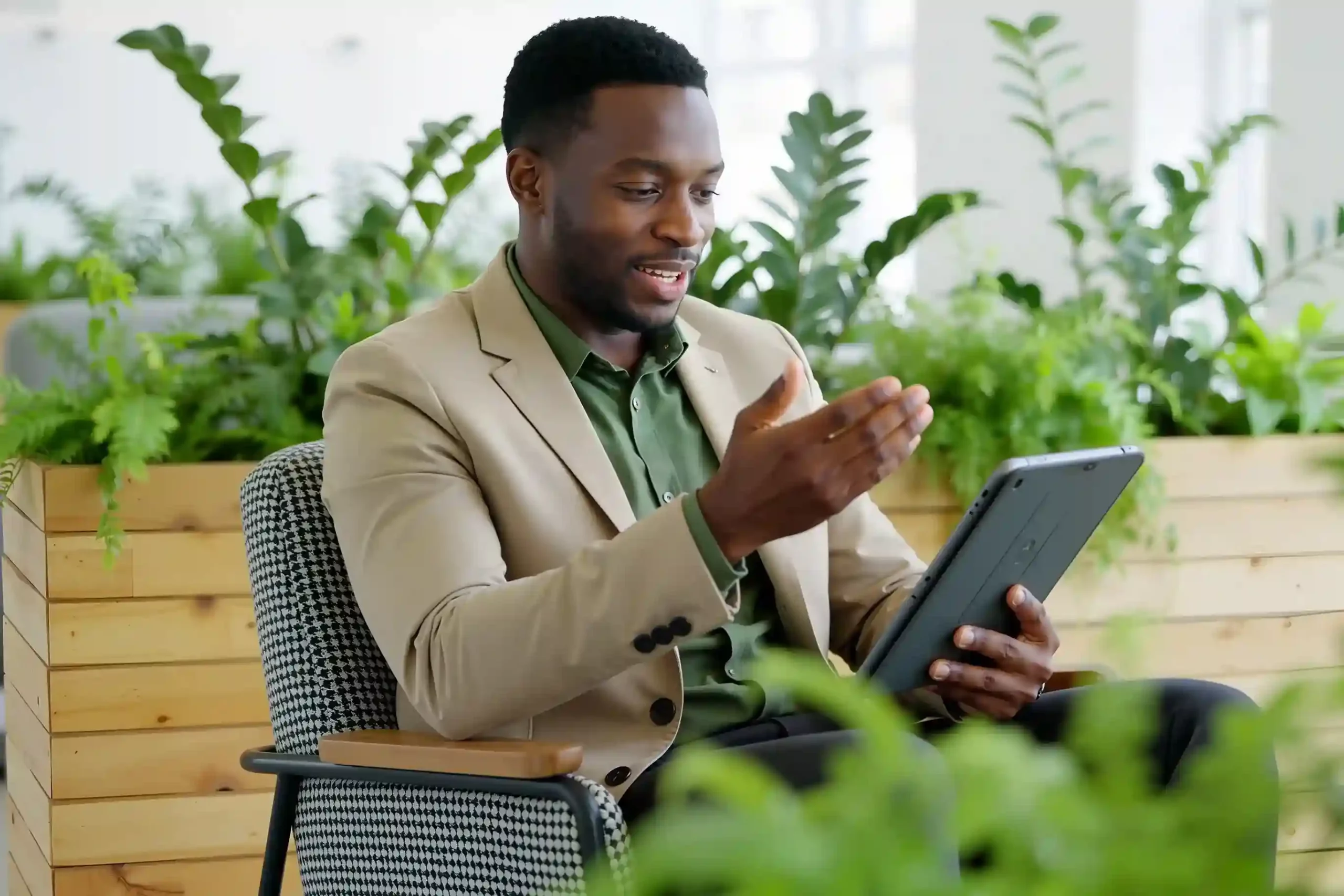 Enterprise team customizing workflows and integrations through Indosoft’s API-driven platform An enterprise director reviewing configurable workflows and API integrations with Indosoft while analyzing operational data on a laptop