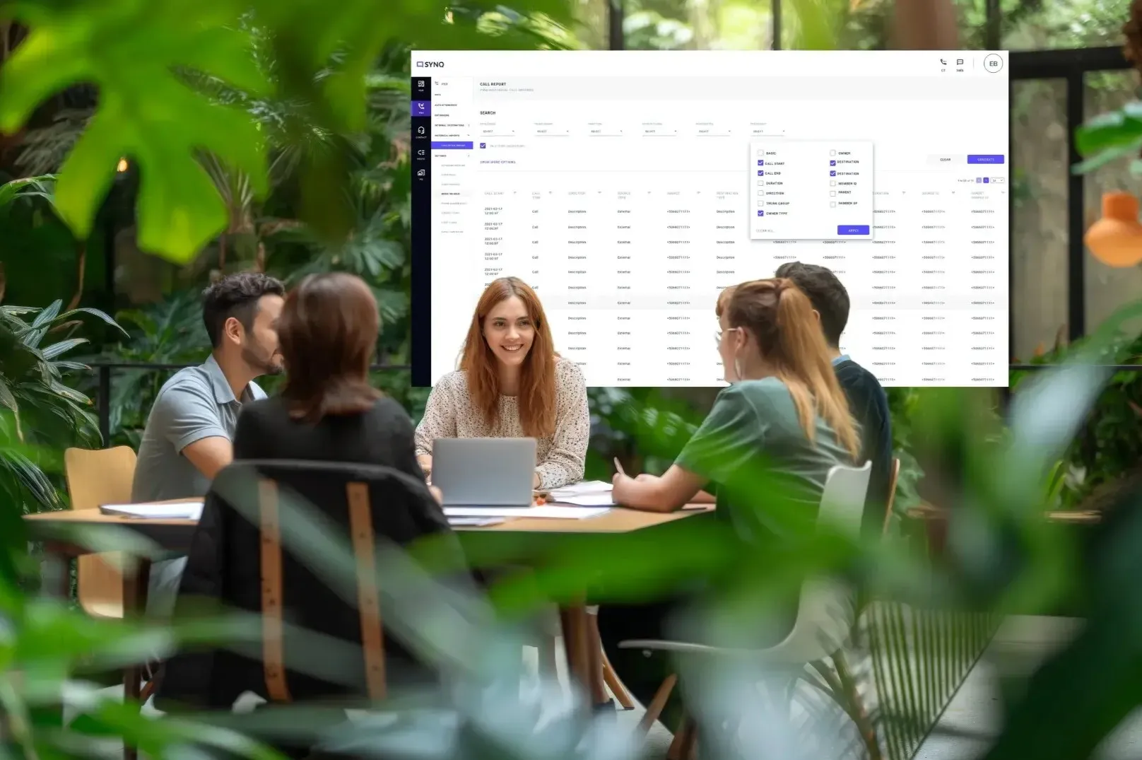 An Indosoft employee presenting a high-performance enterprise communication solution to clients during a strategic discussion. An Indosoft enterprise consultant discussing a scalable communication platform with clients using a laptop in a collaborative meeting.