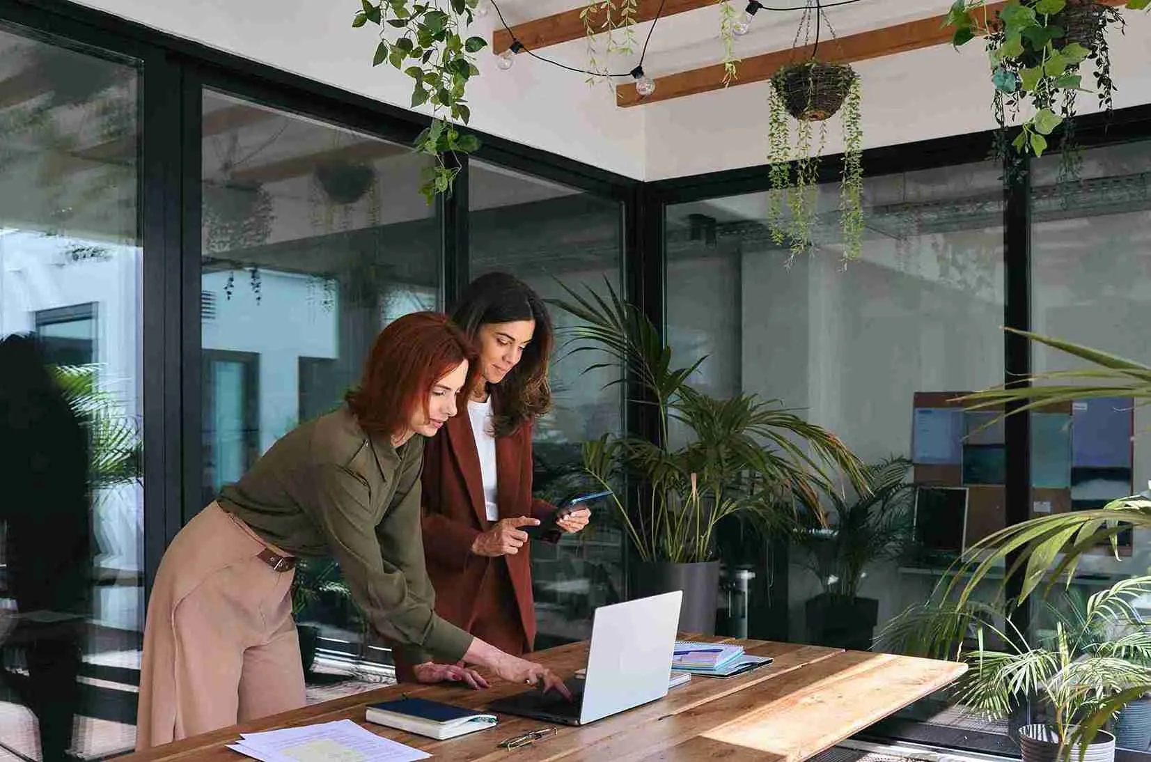 Enterprise professionals discussing audit trails and data protection controls using Indosoft A legal and compliance team reviewing sensitive client data securely using Indosoft’s encrypted and compliant platform