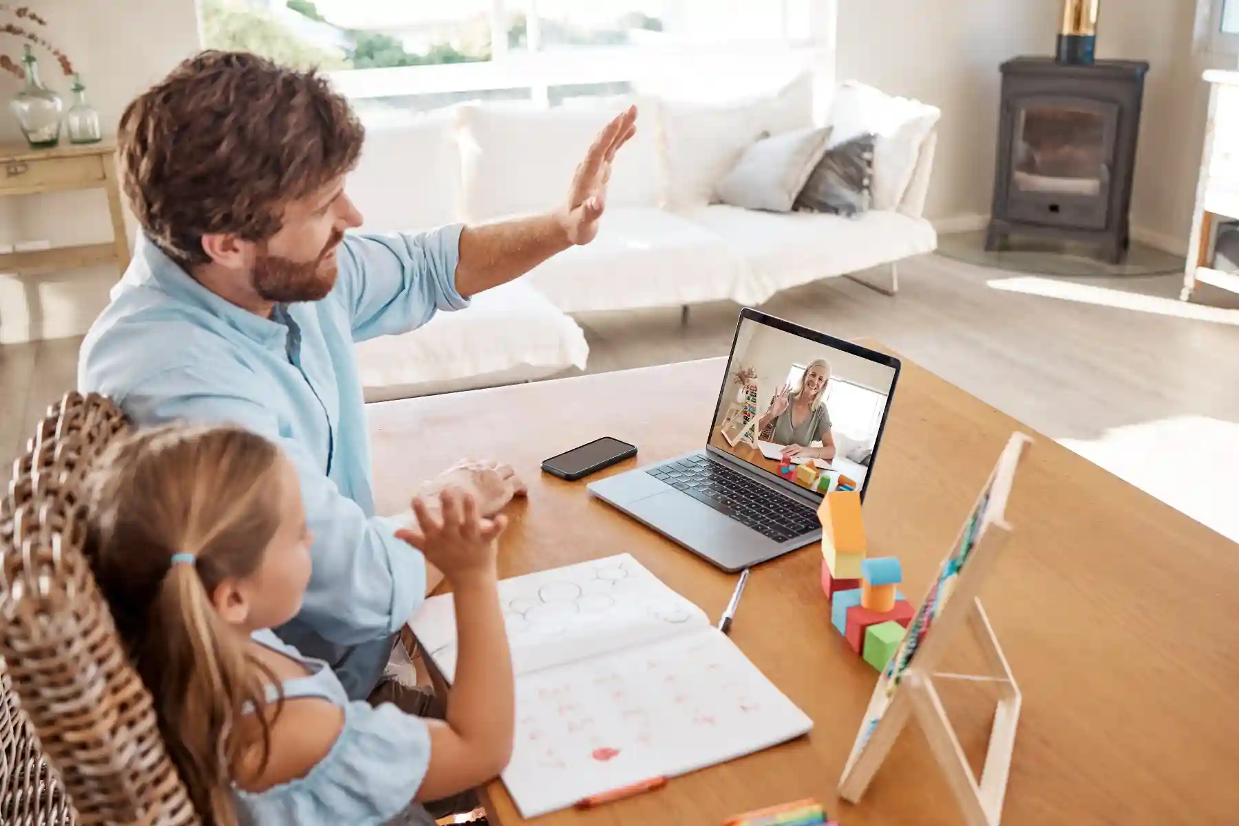 A modern virtual classroom where a teacher connects with a student and her parent, illustrating Indosoft’s ability to support enrollment conversations online. A student and her father join their teacher in a virtual meeting, demonstrating how Indosoft enables flexible engagement through video calls, chat, and online messaging.