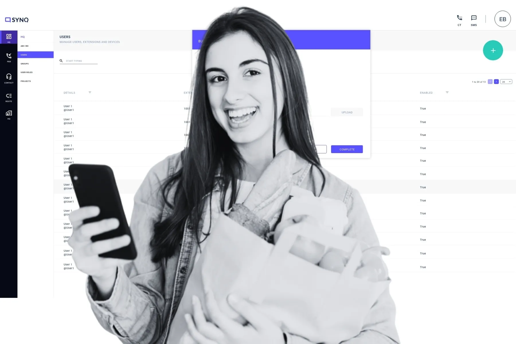 A call center manager smiles while reviewing her mobile device, as an AI-powered user management dashboard runs in the background, reflecting how Asterisk and AI integration simplify team oversight and intelligent call handling.