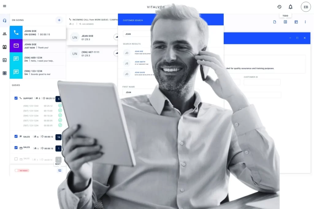 A confident contact center agent handles a live phone call while reviewing a tablet, as an intelligent platform displays active queues, ongoing interactions, and real-time customer search results behind him, showing how proactive contact center intelligence keeps agents ahead of every customer need.